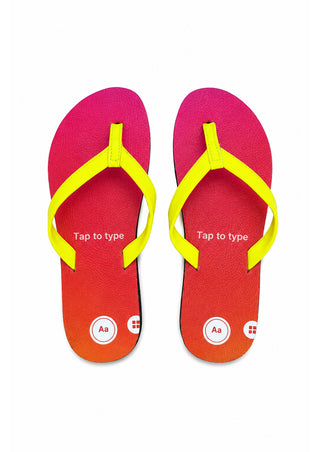 A pair of flip flops with a bright pink-to-orange gradient footbed and neon yellow straps, shown from a top-down view on a white background.